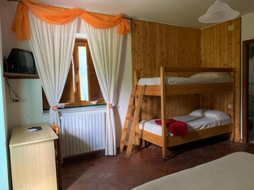 Postel nebo postele na pokoji v ubytování Residence il Varco del Pollino