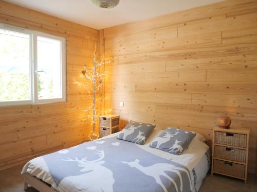 מיטה או מיטות בחדר ב-Maison Cosy Lac d'Annecy