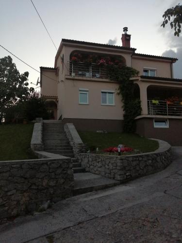 a house with stairs leading up to it at Valnea in Viskovo
