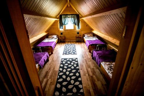 an overhead view of a room with four beds at Villa Zastań in Międzywodzie