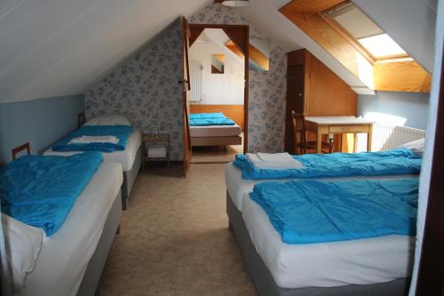 Кровать или кровати в номере De Biesenberg