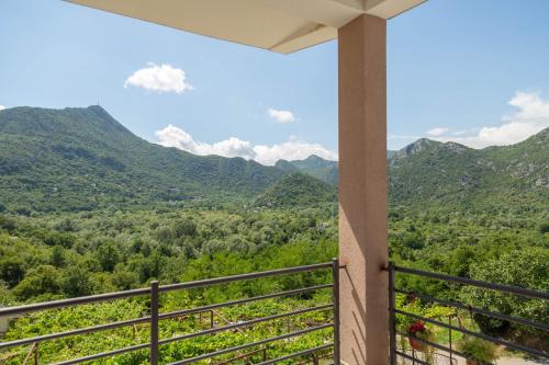 a balcony with a view of the mountains at Brioni in Virpazar