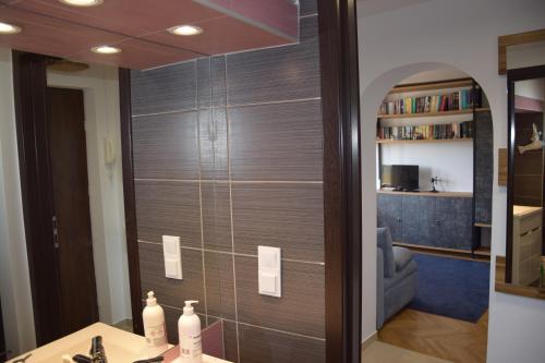 a bathroom with a shower with a glass wall at Apartament Kolejowa in Białystok