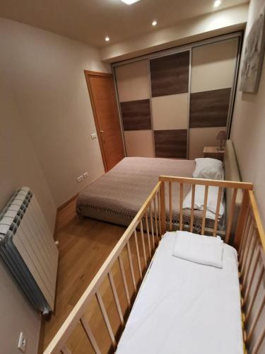 Llit o llits en una habitació de Apartman Ana