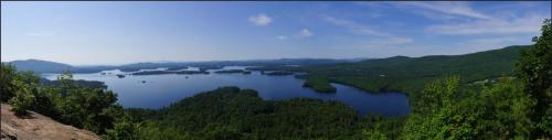 a view of a large lake in the mountains at Yankee Trail Motel in Holderness