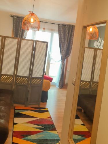 a living room with a door and a rug at Estudio Vigo Centro Lux in Vigo