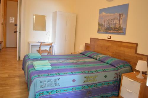 Ένα ή περισσότερα κρεβάτια σε δωμάτιο στο Casa vacanza Tigor