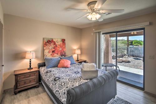 a bedroom with a bed and a ceiling fan at Lake Havasu City Home with Views 3 Mi to Marina! in Lake Havasu City
