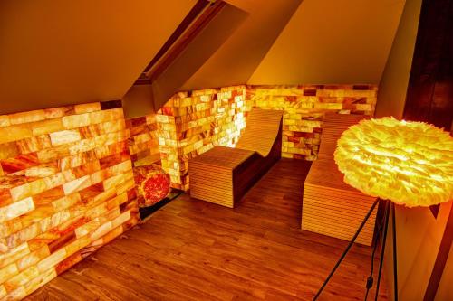 a room with benches and a fireplace in a room at Apartments Marconio Wellness Club in Belgrade