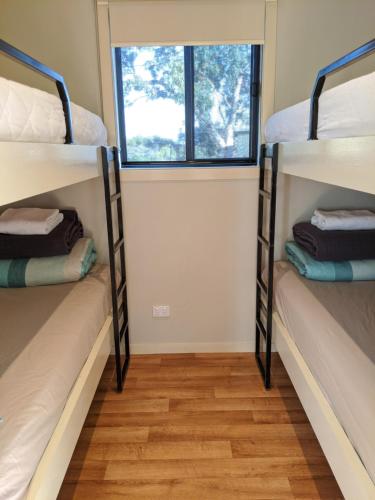a bunk bed with two bunk beds in a room at BIG4 Aireys Inlet in Aireys Inlet