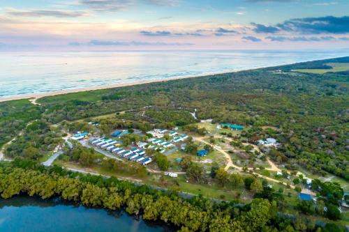 an aerial view of a resort next to the water at Ballina Beach Nature Resort in Ballina