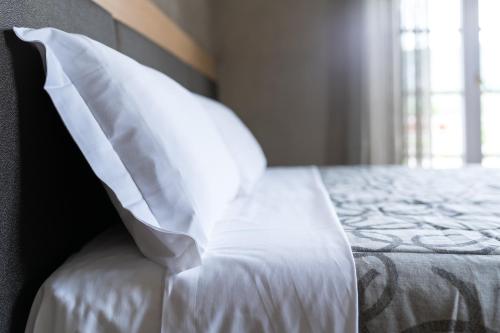 Krevet ili kreveti u jedinici u okviru objekta Hotel Conca D'Oro ***S