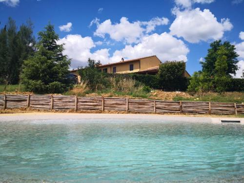 a house on a hill next to a beach at Casanova in Scandicci