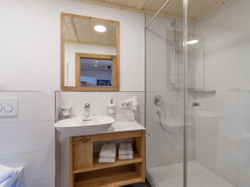 a bathroom with a sink and a shower at Appartement Hinterholzer in Going