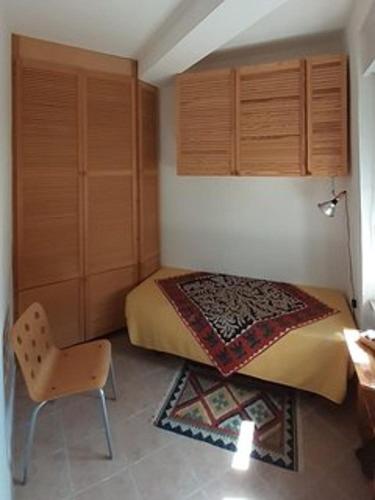 En eller flere senger på et rom på Appartamento Fontana Melograno