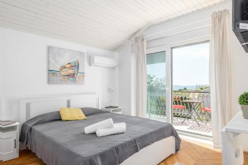 Posteľ alebo postele v izbe v ubytovaní Villa Polion Peroj