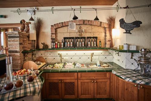 a kitchen with a counter with food on it at Hotel Donauhof in Emmersdorf an der Donau