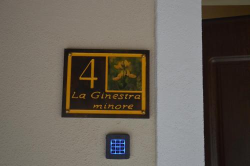 a sign on a wall that says la christophe minuto at I fiori del Pollino - Guest House in San Severino Lucano