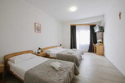 Voodi või voodid majutusasutuse Hotel Dubrovnik Međugorje toas