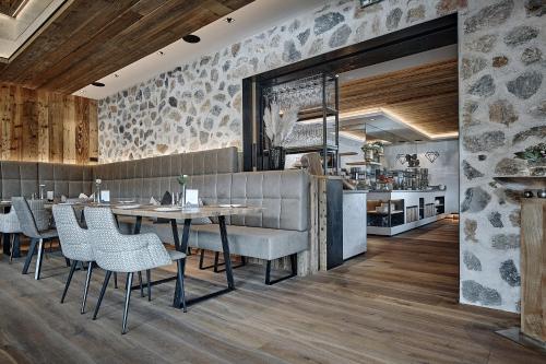 a dining room with a table and chairs at Rainerhof in Flachau