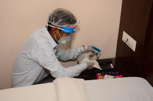 a man wearing a mask and a mask at Hotel 49 in Amritsar