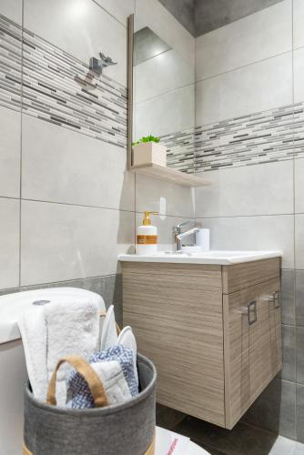 a bathroom with a sink and a mirror at Kolymbia memories house in Kolymbia