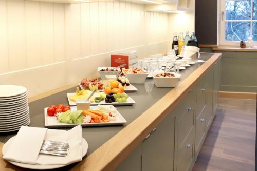 a buffet line with many plates of food on it at Hotel & Restaurant Waldblick in Pulsnitz
