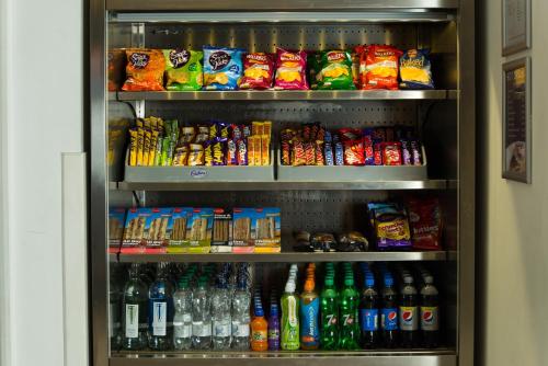 a refrigerator filled with lots of different types of drinks at Holiday Inn Express Hemel Hempstead by IHG in Hemel Hempstead
