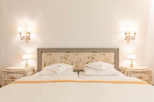 Ένα ή περισσότερα κρεβάτια σε δωμάτιο στο Hotel Elephant