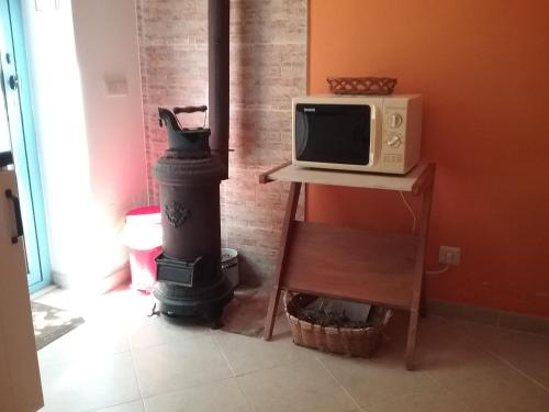 a kitchen with a stove and a microwave at Manta Rota Beach,open space apartment , terrace,garden in Manta Rota