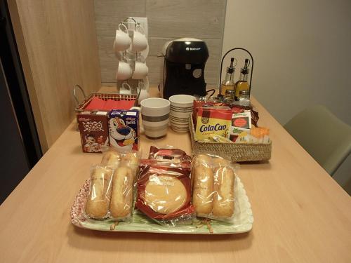 a table with a group of sandwiches and other snacks at Apartamento El Aljibe de la Luz in Toledo