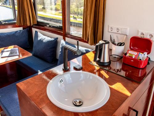 a bathroom with a sink in a train room at SWEETS - IJdoornlaanbrug in Amsterdam