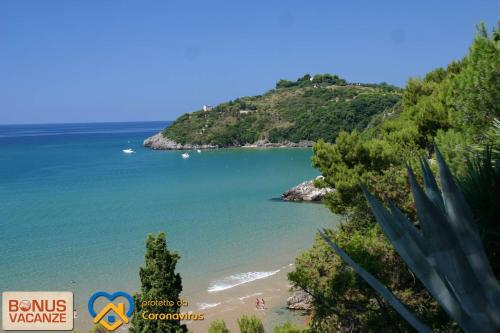 a view of a beach with people on it at Livingapple in Scauri