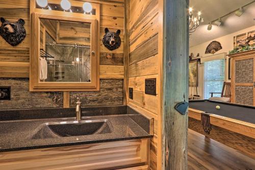 a kitchen with a sink and a pool table at Eclectic Cabin with Hot Tub 1 Mi to Ober Gatlinburg in Gatlinburg