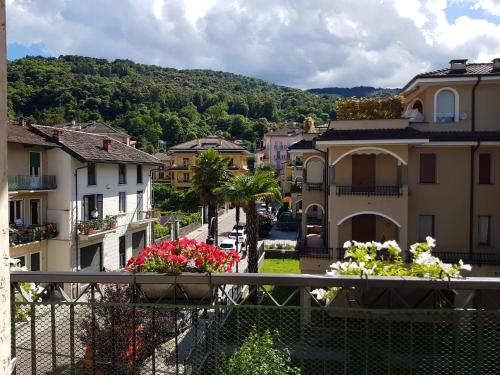a view of a town with buildings and flowers at Fior&Iris Apartments in Stresa
