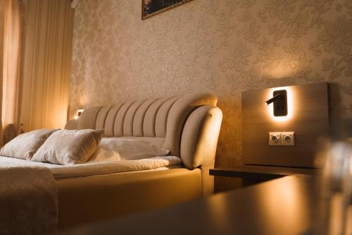 a living room with a couch and a table at Globus Hotel in Ternopilʼ