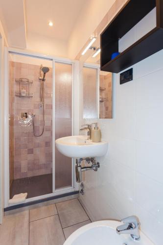 a bathroom with a sink and a shower at Stella Marina in Camogli