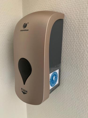a toaster is hanging on a wall at Koksijde App Zeelaan B3 in Koksijde