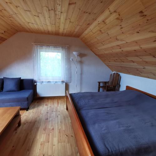 Una cama o camas en una habitación de Burziņi