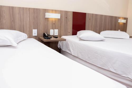 Ένα ή περισσότερα κρεβάτια σε δωμάτιο στο Hotel e Restaurante Champagne