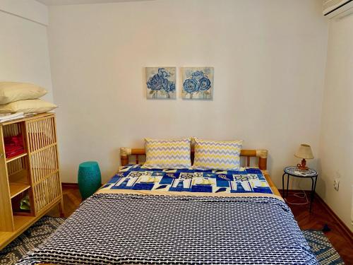 En eller flere senge i et værelse på Apartament Toate Panzele Sus