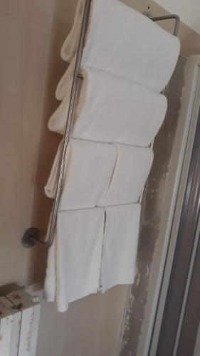 a stack of white paper on a wall at Locanda Ermes in Capaccio-Paestum