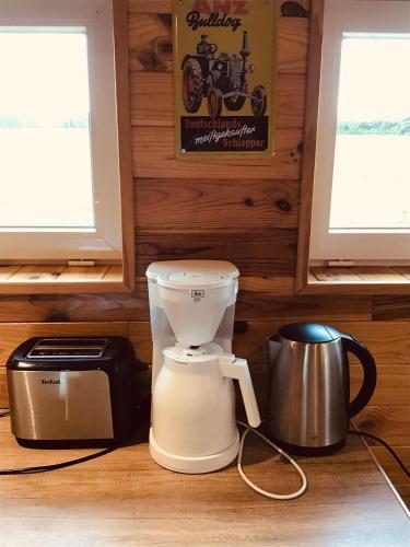 Il comprend une cuisine équipée d'un mixeur et d'un grille-pain. dans l'établissement le chalet de la ferme du tertre, à Villers-au-Tertre