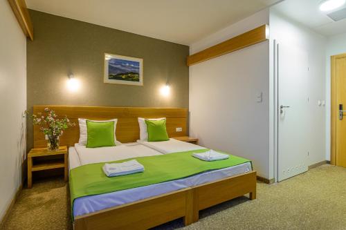 
Łóżko lub łóżka w pokoju w obiekcie Hotel Bachledówka
