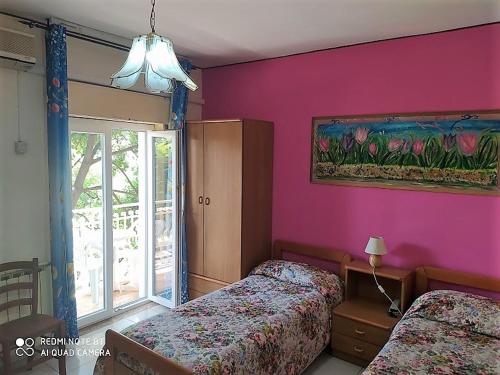 Postel nebo postele na pokoji v ubytování Hotel Eliseo