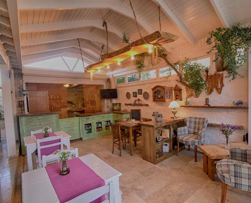 a large kitchen with a table and chairs at Perla Rossa Alacati in Alacati