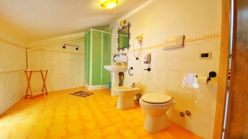 a bathroom with a toilet and a sink at Casa Santicelli Maratea “ Il Campanile” in Maratea