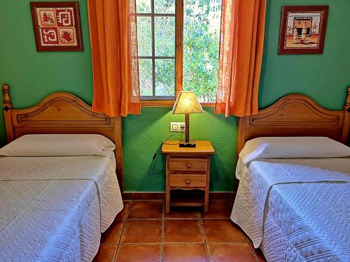 En eller flere senge i et værelse på Casa Laguna del Maiz cazorla