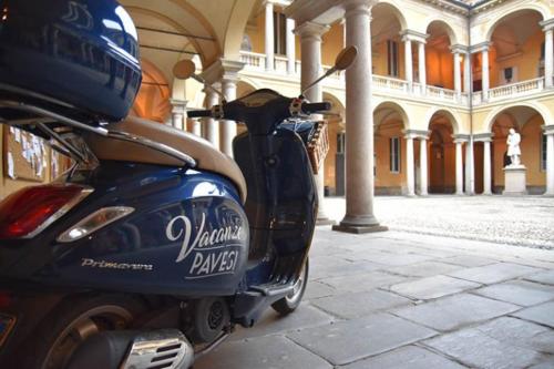a blue motor scooter parked in a building at Le Stanze del Cardinale in Pavia