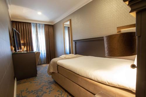 Кровать или кровати в номере Good Seasons Hotel Den Bosch